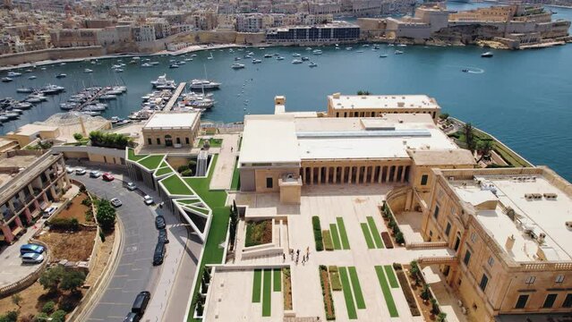 Sliding aerial view of Villa Bighi and docks, Valletta, Malta