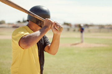 Baseball, athlete and man with a bat on the pitch playing a sport game or fitness training. Sports, softball and man practicing his batting for a match at outdoor field or stadium with a wood baton.