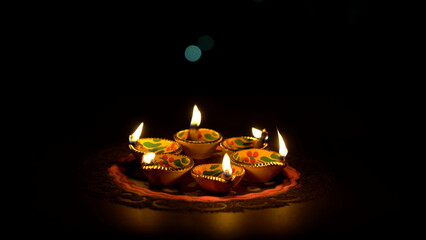 Colorful diya lamps lit during diwali celebration. Indian festival Happy Diwali, Holiday...