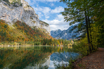 Fototapeta na wymiar Lake Leopoldstein (Leopoldsteinersee) in the state of styria, austria near the city eisenerz in autumn