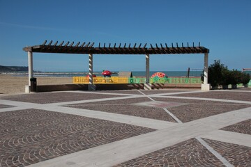 Italy, Marche: Children's games on the beach.