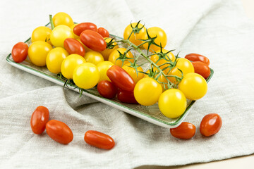yellow and red cherry tomatoes on a plate