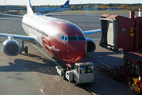 Stockholm, Arlanda Sweden - October 11, 2022: aircraft being towed to the disembarkation bridge