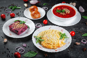 Traditional National Kazakh dishes Kazakh borscht, beet salad with walnuts. .Cooked from beef or lamb
