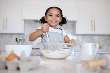 Happy girl kids baking in kitchen, house and home for childhood fun, learning and development....