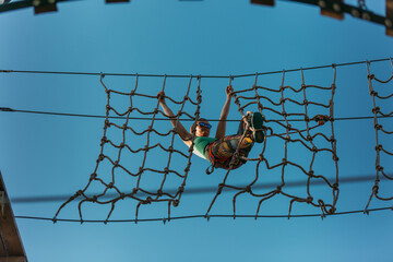 Woman hanging on the net wall