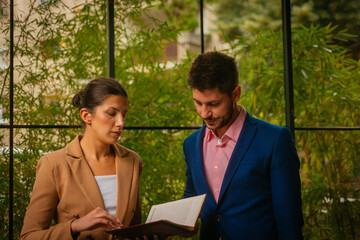 Beautiful business people standing in a coffee bar
