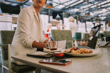 Writting notes at the cafe