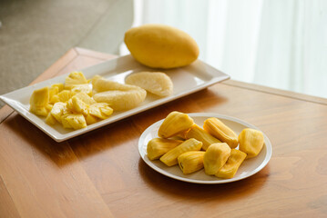 pineapple pomelo and jackfruit on a white plate
