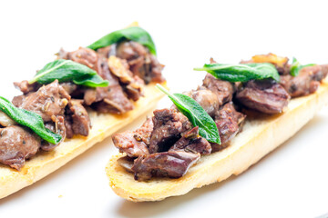 roasted livers on toasted baguette with sage leaves