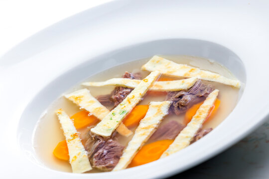 beef soup with celestine noodles and carrot