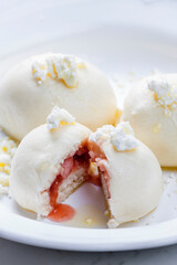 dumplings filled with strawberries served with cottage cheese