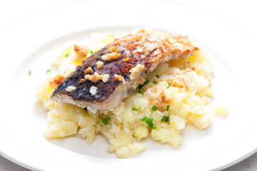 grilled carp with garlic served with mashed potatoes