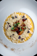 Porridge with butter and mushrooms on a plate