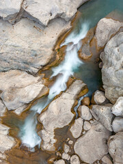 River flowing between rocks with motion blur shot with long exposure technique