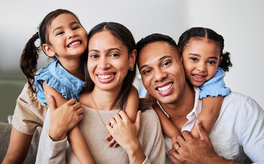 Hug, children and parents on the sofa in the living room of their house for love, care and smile...