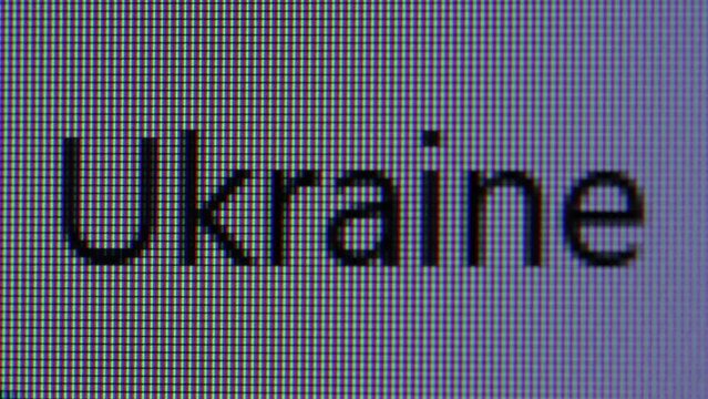 User enters word Ukraine in search bar tnen deletes it by backspace and enters text Russia in internet browser on computer. Query. Super Macro pixels of monitor screen display. Political news