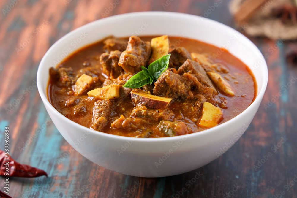 Wall mural spicy beef curry. goan style beef vindaloo. traditional indian lamb or beef curry . spicy beef curry