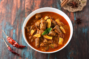 Spicy beef curry. Goan style beef vindaloo. Traditional Indian Lamb or beef curry . spicy Beef curry gravy popular in Kerala Sri Lankan Goa for Appam, Parotta porotta in India.