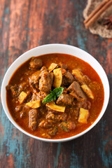 Spicy beef curry. Goan style beef vindaloo. Traditional Indian Lamb or beef curry . spicy Beef curry gravy popular in Kerala Sri Lankan Goa for Appam, Parotta porotta in India.