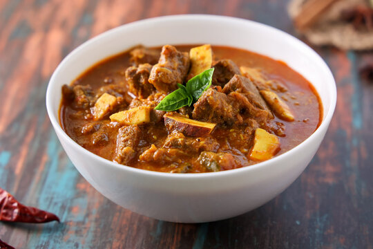 Spicy beef curry. Goan style beef vindaloo. Traditional Indian Lamb or beef curry . spicy Beef curry gravy popular in Kerala Sri Lankan Goa for Appam, Parotta porotta in India.