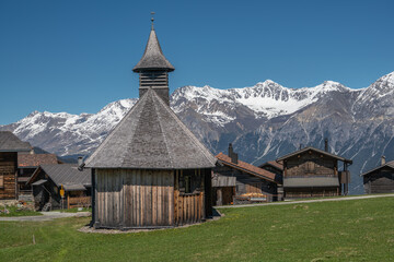 Obermutten, Graubünden, showing the refomed church, built in 1718 from larch wood. It is the highest wooden church in Europe