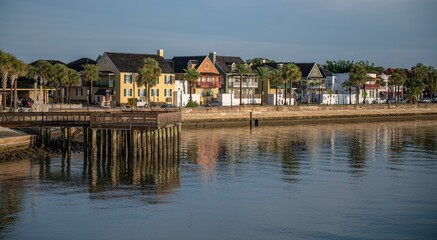 View of a pier with buildings on the shore. St Augustine, Florida, USA.