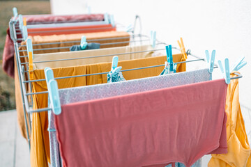 Clean towels hanging on dryer in outdoor. 