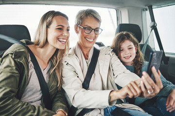 Phone, selfie and happy family in a car for a road trip driving or traveling to a holiday vacation...