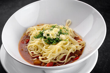 Pasta with vegetable sauce, cheese and dill