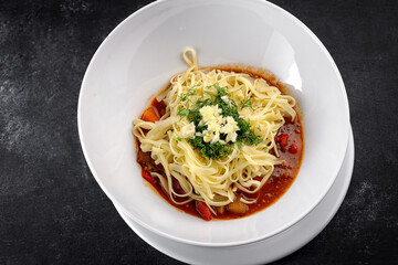 Pasta with vegetable sauce, cheese and dill