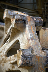 Parts of a large metal gear. Large machine parts.