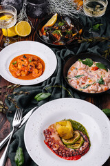 Octopus Sicilian, Salmon in cream sauce, Shrimp in Romesco sauce and Mussels