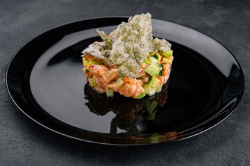 Delicious avocado and raw salmon salad, tartare