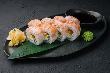 shrimp rolls on black stone plate