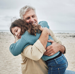 Happy, grandfather and child hug on beach for love, care and family bonding in the outdoors. Grandpa hugging grandchild embracing relationship in joyful happiness for free time together in nature