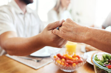 Family, hands and thanksgiving lunch prayer in house, home and restaurant with men, women and food. Zoom, worship praying community with hand, parents or seniors for festive food at dinner table