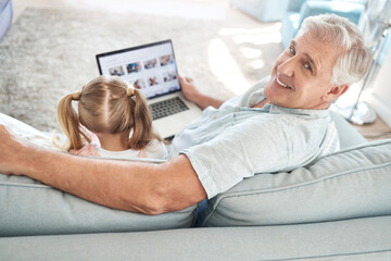Love, child and laptop on sofa with grandfather for screen app leisure together in Australia. Smile...