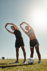 Soccer couple stretching at park, people workout on outdoor football field or coach training for...