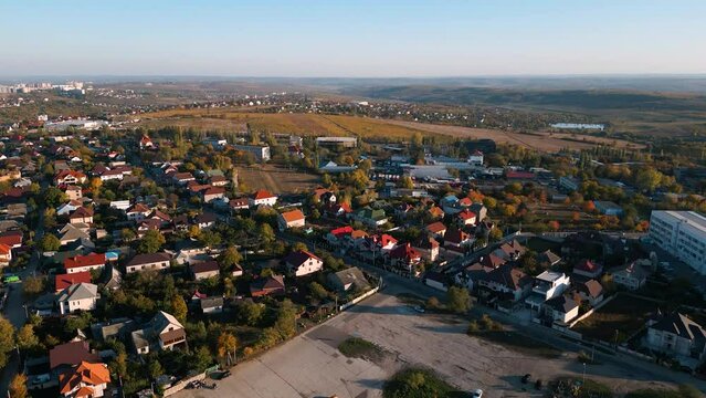 Aerial drone flyover the family homes in the outer districts of the capital Chisinau of Republic of Moldova - bird view of living sleeping quarters on an autumn day in 2022 flying south of the city