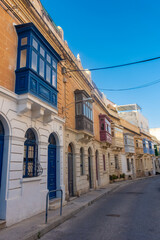 Fototapeta na wymiar Typical maltese colorful balconies in a street of Sliema, Malta