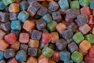 Closeup of a  heap of sweet colorful cube candies.
