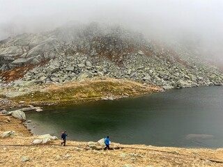 Mystical autumn ambience on the alpine lake Lago d'Orsino in the mountainous area of the St....