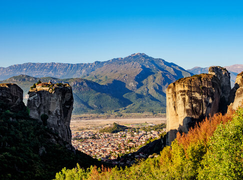 View towards the Monastery of the Holy Trinity and Kalabaka at sunrise, Meteora, UNESCO World Heritage Site, Thessaly