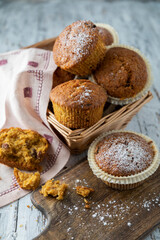 Homemade cupcakes on a light wooden table