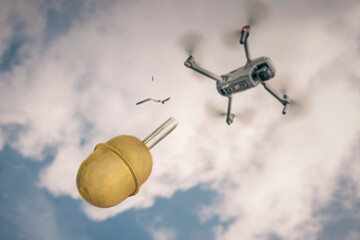 Concept using quadrocopters in smart war. grenade falling from small quadrocopter flying in the...