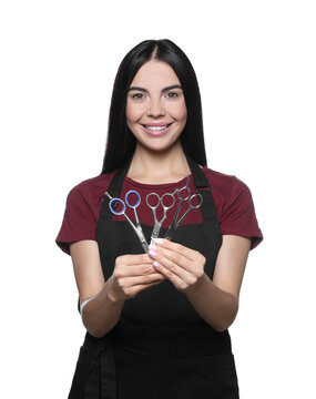 Portrait of happy hairdresser with professional scissors on white background
