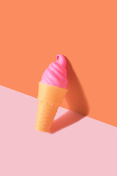 Pink ice crem on orange and pink background. Creative minimal concept.