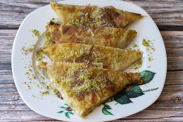 Traditional Turkish Dessert Katmer, clotted cream, dough, katmer dessert of Turkey Gaziantep...