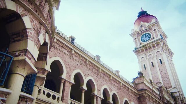 Medium close-up track shot of Sultan Abdul Samad Building, an old heritage 1900 building 
- Kuala Lumpur, Malaysia.